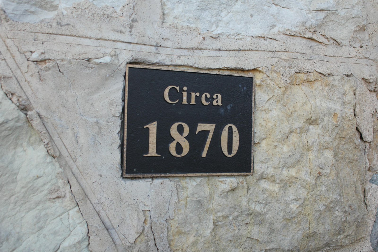 Plaque on stone arch